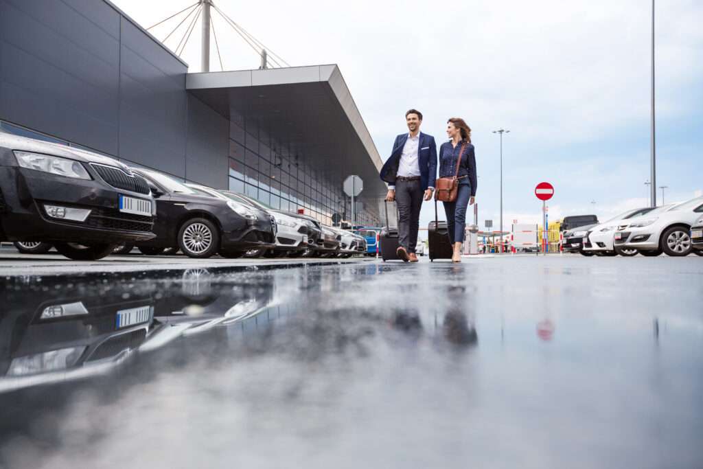 Businesspeople in an airport car parking